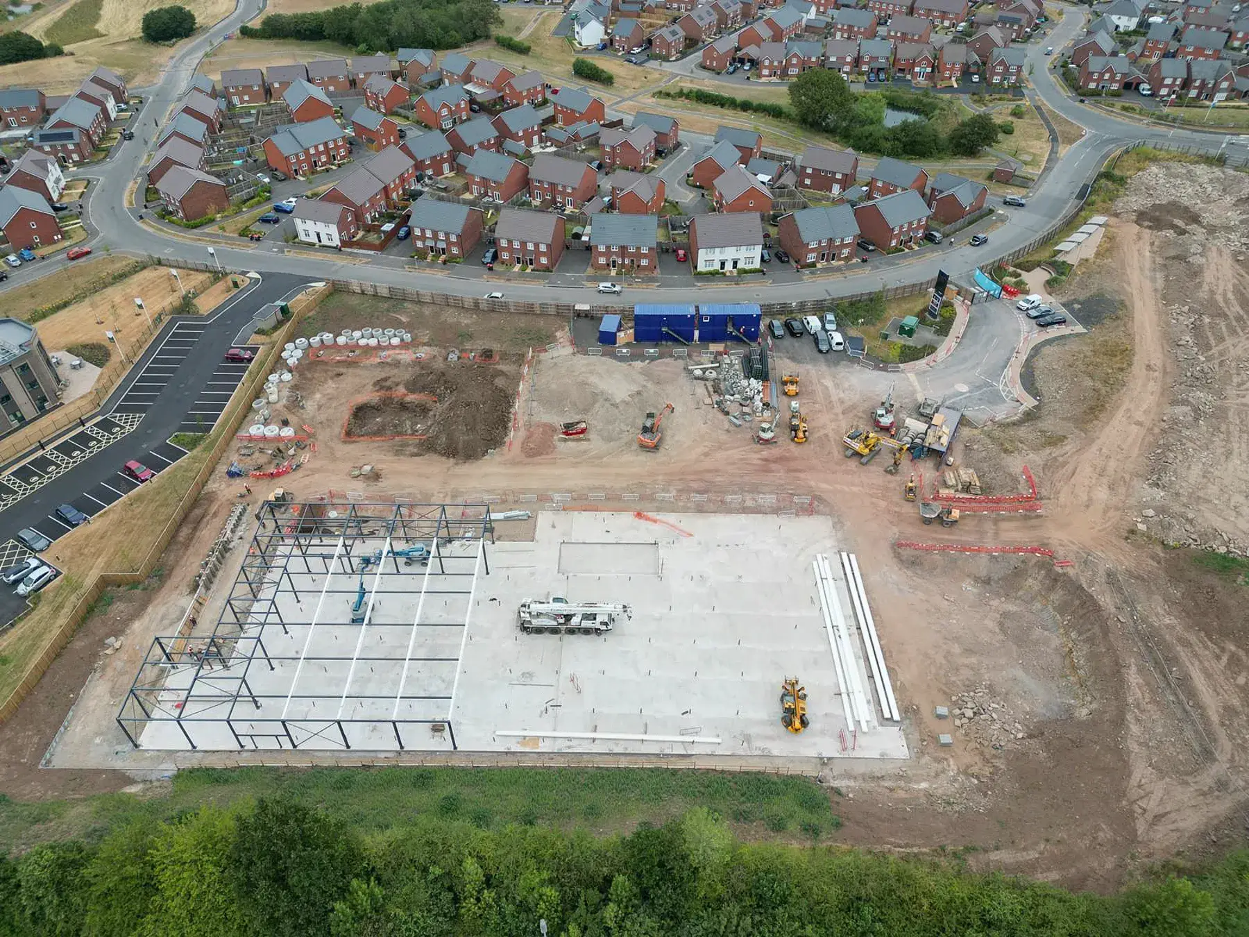 Stonedale-Construction-Lidl-Telford-Project-8 Aerial view of Lidl Telford store construction showing steel frame, concrete slab and groundworks